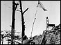 US marine hoists flag 