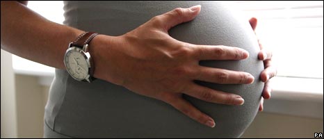 Woman who is eight months pregnant