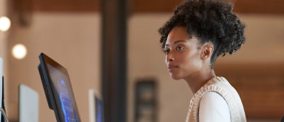 A person looking at a computer screen.