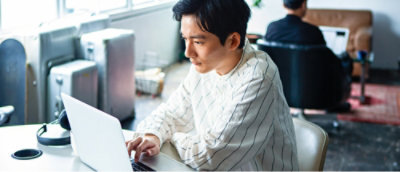 A person typing on a laptop.