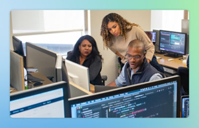 A group of people working on computers.