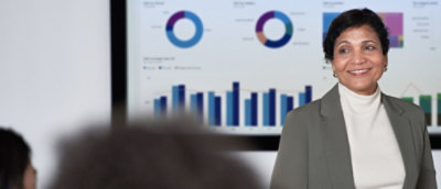 A women standing in front of a presentation screen