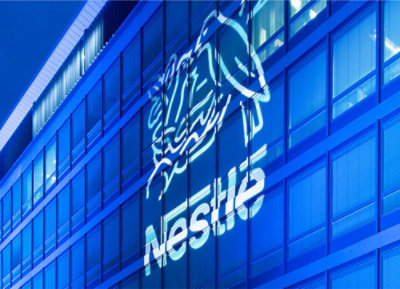 A close-up of a building with a blue and white logo on it.