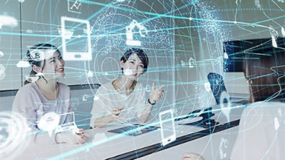group of people discussing with digital hologram gadgets