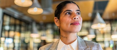 A close-up of a person's face looking up to the side.
