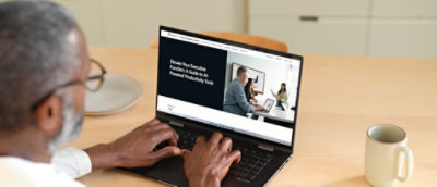 A person typing on a laptop.