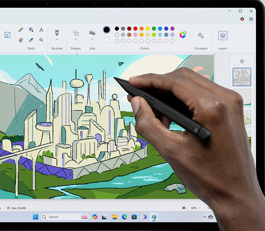 A person’s hand using a pen to create a city skyline in Paint