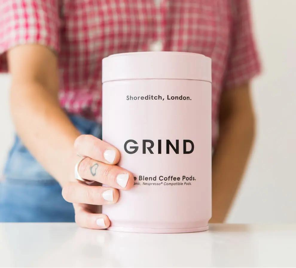 Close-up of a canister of Grind coffee pods