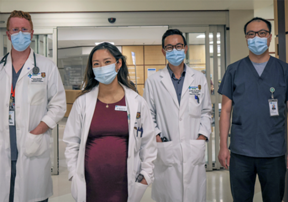 Four health care working standing together