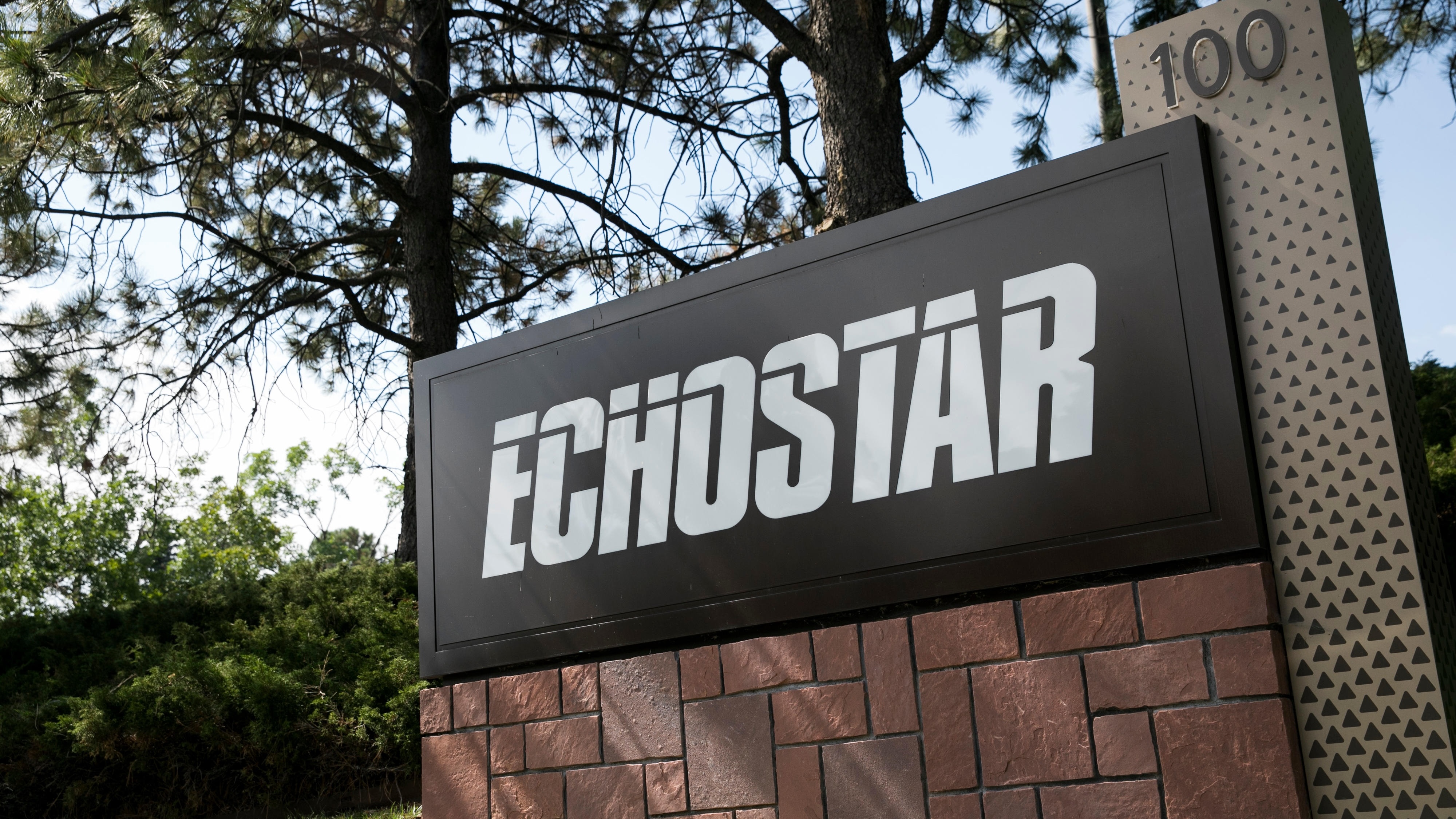 EchoStar logo sign outside company headquarters in Englewood, Colorado