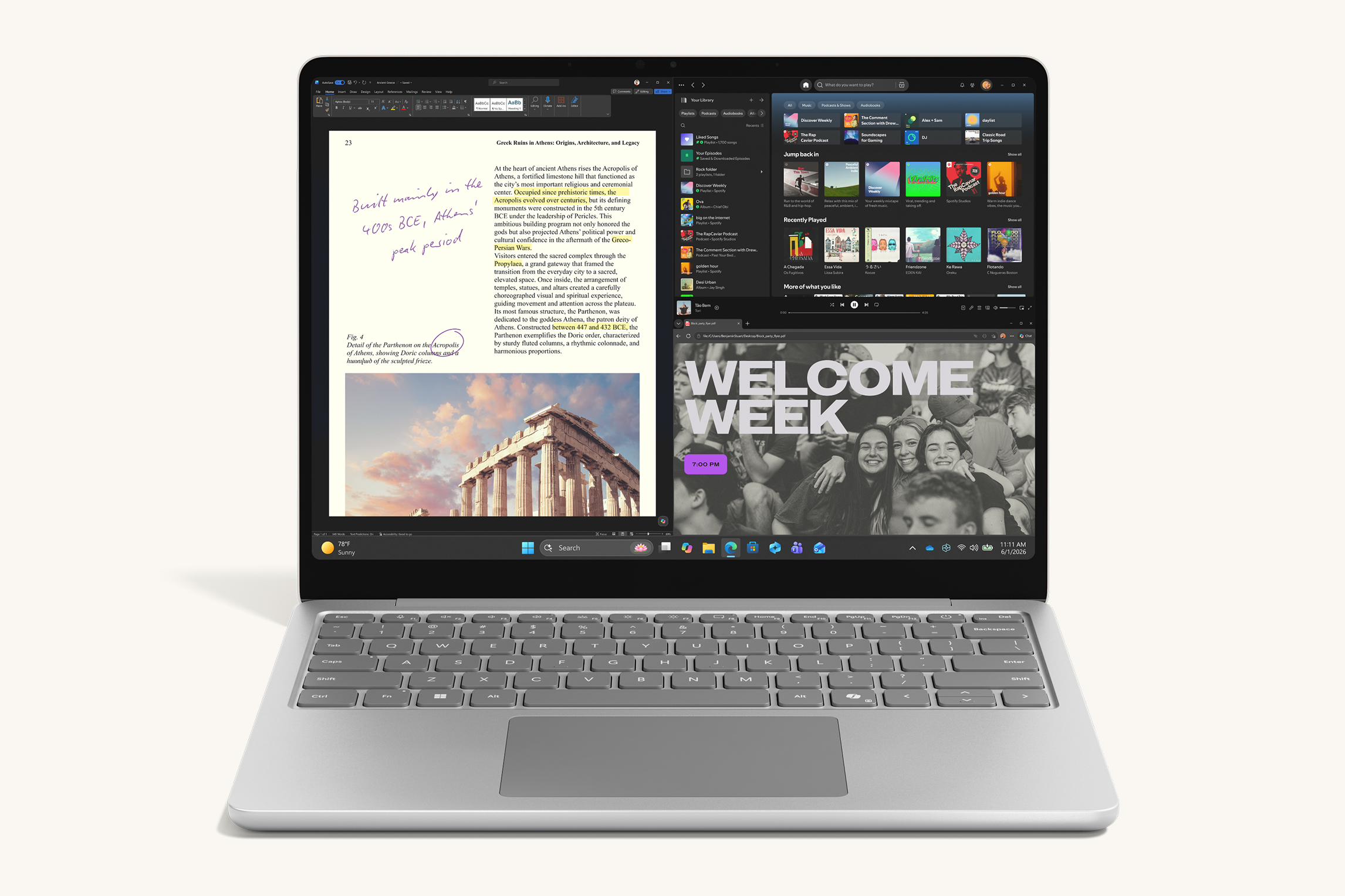 Platinum 13-inch laptop displaying a split-screen view with document editing, music app and web content