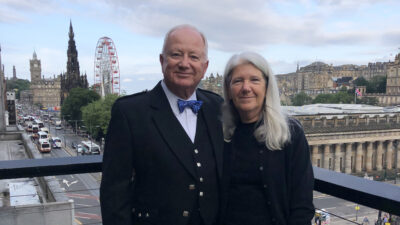 a man and a woman pose for a picture