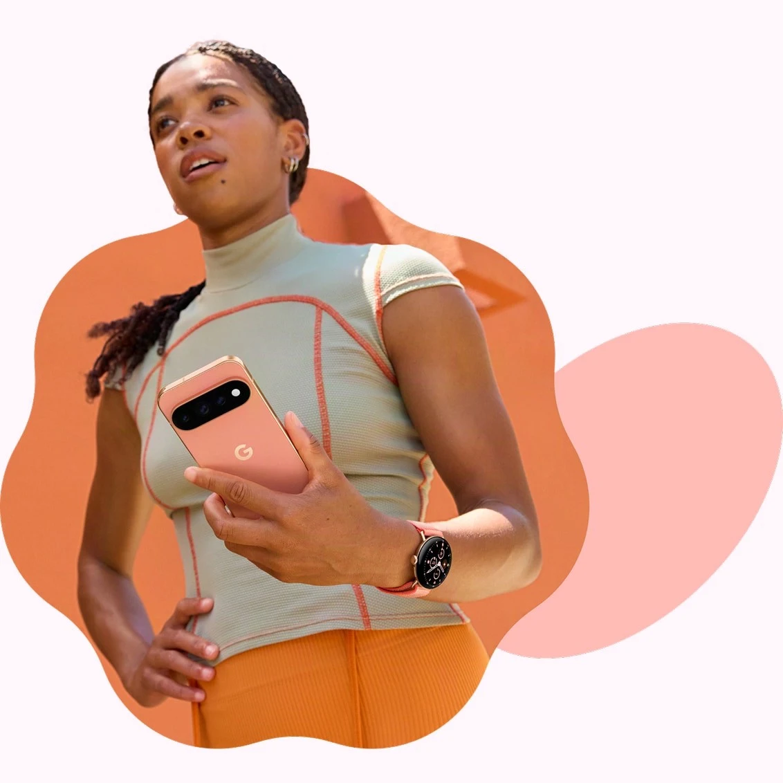 A person standing outdoors in athletic wear, holding a Google Pixel 11 in Canyon and wearing a Google Pixel Watch 5 with a Canyon band.