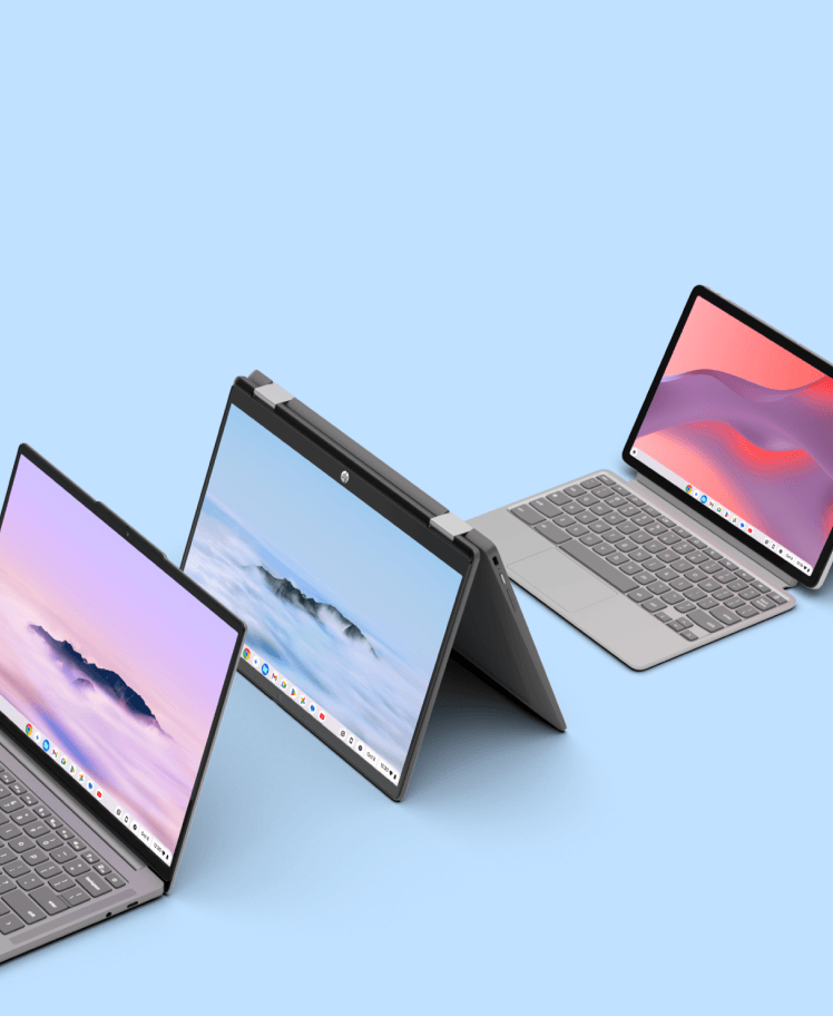 Three modern laptops with vibrant wallpapers displayed on screens, angled on a light blue background.