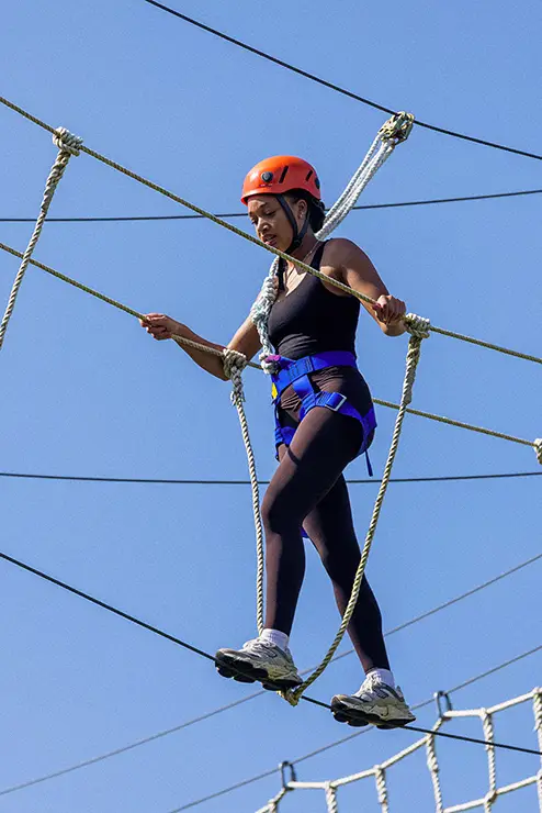 a future SEMO student particpates in the rope challenge course during camp redhawk a summer camp cape girardeau mo