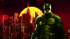 Batman in green armor stands before a red-lit city with a yellow moon. — Yellow Wallpaper