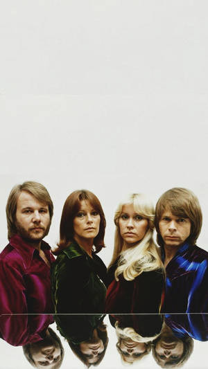 Four musicians in velvet shirts with inverted reflections on white background. — Abba Wallpaper