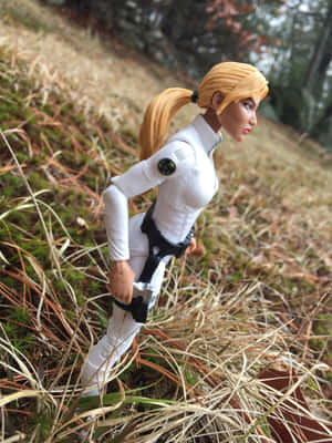 Blonde action figure in white tactical gear standing in grassy field. — iPad Air 13 Wallpaper