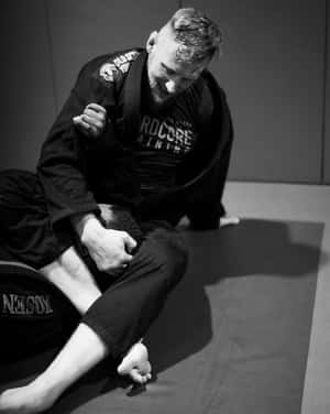 Two men grappling in a martial arts gym on a mat. — Gym Wallpaper