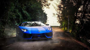 Blue sports car parked on a forest road at sunset. — Lamborghini Wallpaper
