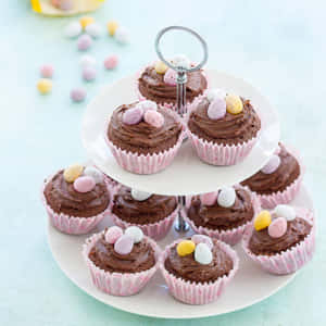 Chocolate cupcakes decorated with pastel candy eggs on a tiered stand. — iPad Air 11 Wallpaper