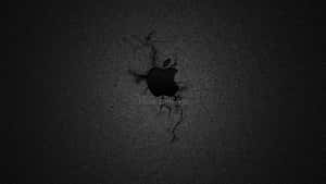 Cracked black surface revealing Apple logo and Think Different text. — Disparate Wallpaper