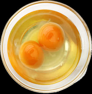 Two egg yolks in clear egg white inside a white bowl. — Food PNG