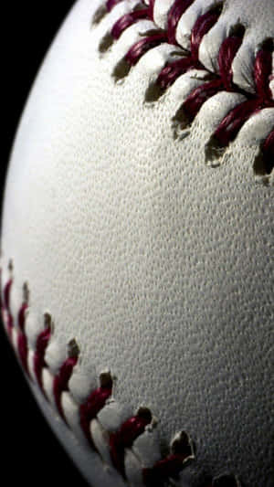 Close-up of a baseball's red stitching and textured white leather. — iPhone 5 Wallpaper