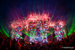 Crowd at night festival under fireworks and laser lights. — Edm Wallpaper
