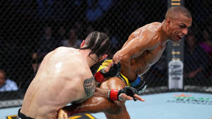 Two MMA fighters locked in a fierce grappling match inside an octagon. — Showdown Wallpaper