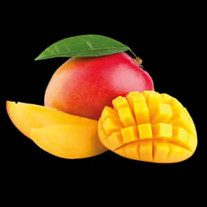 Ripe mango with green leaf and sliced cubed pieces on black background — Fruit Wallpaper