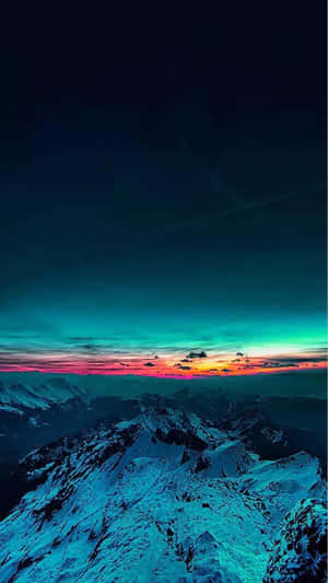 Snowy mountain peaks under a colorful twilight sky with teal pink and orange hues. — iPhone 7 Plus Wallpaper