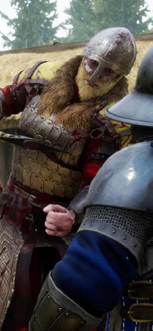 Two armored warriors locked in combat with bloodied helmets and chainmail in a forest. — Showdown Wallpaper