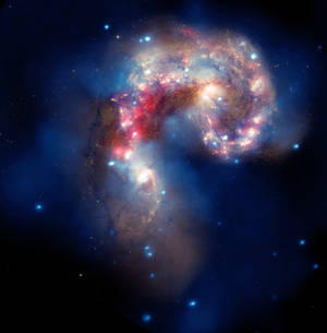 Uma galáxia espiral colorida com nebulosas brilhantes e estrelas espalhadas no espaço profundo. — Universo Papéis de Parede