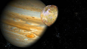 Jupiter en zijn maan Io in een baan om de sterrenkosmos. — Jupiter Achtergronden