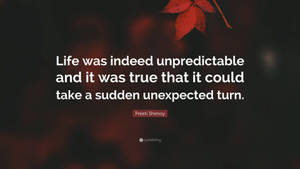 A quote about life's unpredictability with a red autumn leaf against a dark background. — Indeed Wallpaper