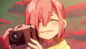 Anime girl with pink hair holding a camera smiling at sunset. — Mbappe Wallpaper