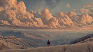 A person stands alone on a hill watching mountains under a starry sky with glowing clouds. — Travel Wallpaper