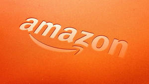 Logo Amazon sur surface orange texturée — Amazon Fonds d'écran