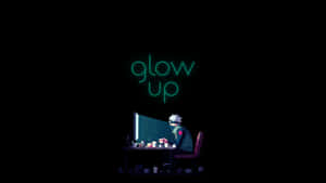 Anime character at desk under glowing monitor with neon text glow up — Applicable Wallpaper