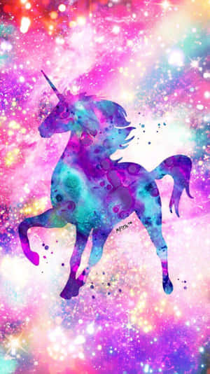 A colorful unicorn silhouette against a glittering cosmic background. — Unicorn Wallpaper