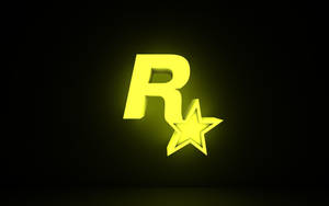 Logotipo amarillo brillante de Rockstar Games con estrella sobre fondo oscuro — Logo Fondos de pantalla