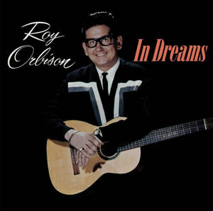 Roy Orlison segurando um violão com texto do título do álbum em fundo preto. — Retrô Papéis de Parede