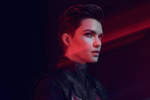 Person in leather jacket under red lighting with serious expression. — Ruby Rose Wallpaper
