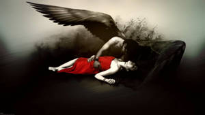 A dark-winged angel kisses a woman in a red dress in a shadowy scene. — Death Wallpaper