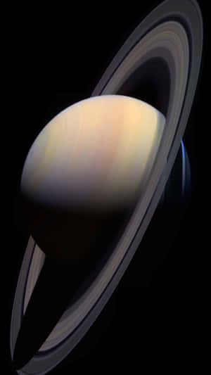Saturn with its rings illuminated in the darkness of space. — Saturn Wallpaper