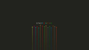 Farbenfrohe Pfeile zeigen nach oben mit dem Text 'STAY POSITIVE' auf dunklem Hintergrund. — Desktop Wallpaper