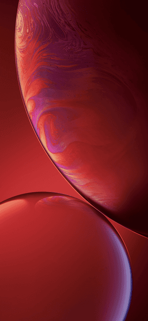 Two floating glossy spheres with swirling red purple and orange gradients. — iPhone Xr Wallpaper