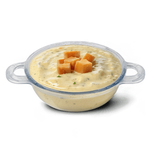 Eine klare Plastikschüssel gefüllt mit cremiger Suppe, belegt mit Käsewürfeln und Kräutern. — Caesar Wallpaper