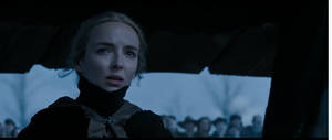 A woman in a dark coat looks up fearfully as a crowd stands in the snowy background. — Duel Wallpaper